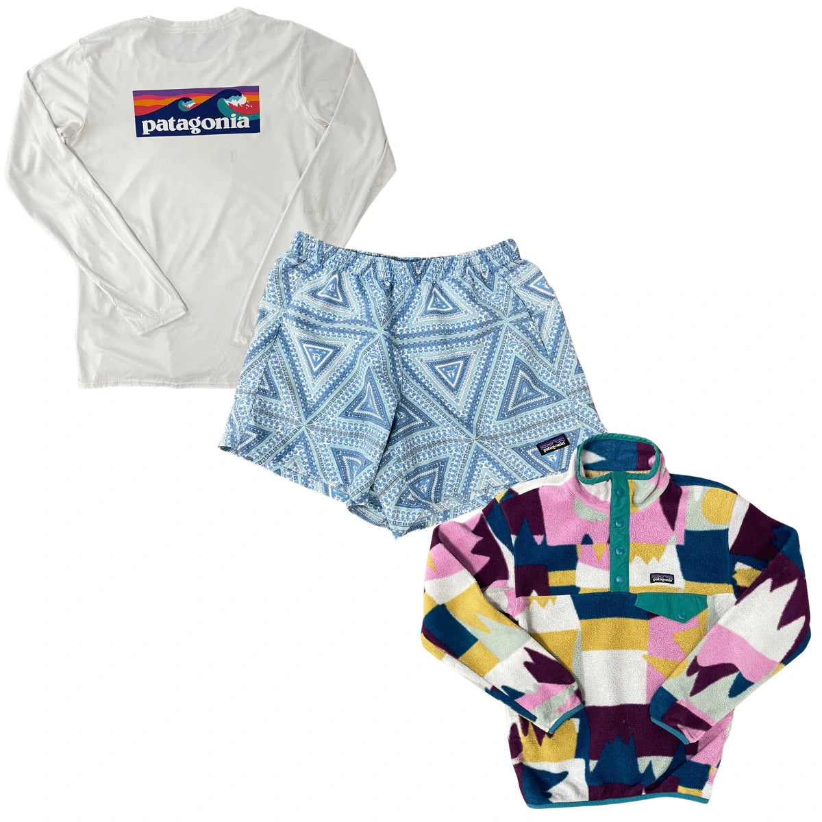 Collection of Three Patagonia apparel items arranged on a white background: a white long-sleeve shirt with a colorful chest logo, light blue patterned shorts, and a multicolor patterned quarter-zip fleece. The Patagonia logo is visible on the shirt, shorts, and fleece. in a gallery layout