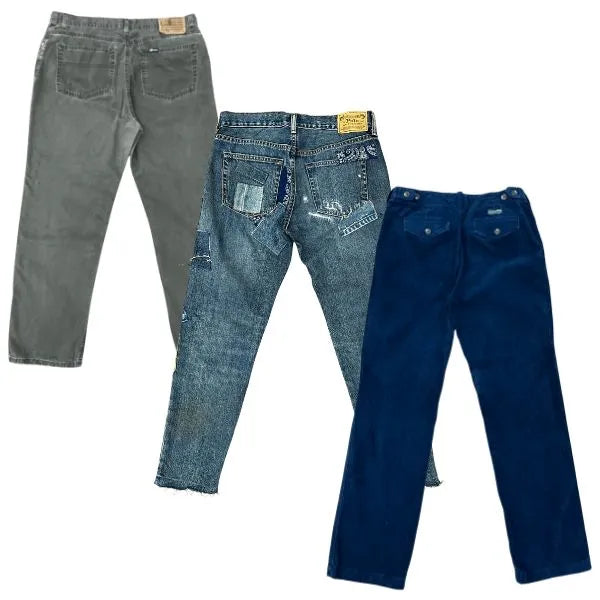 Collection of Three pairs of jeans in gray, blue, and navy on a white background in a gallery layout