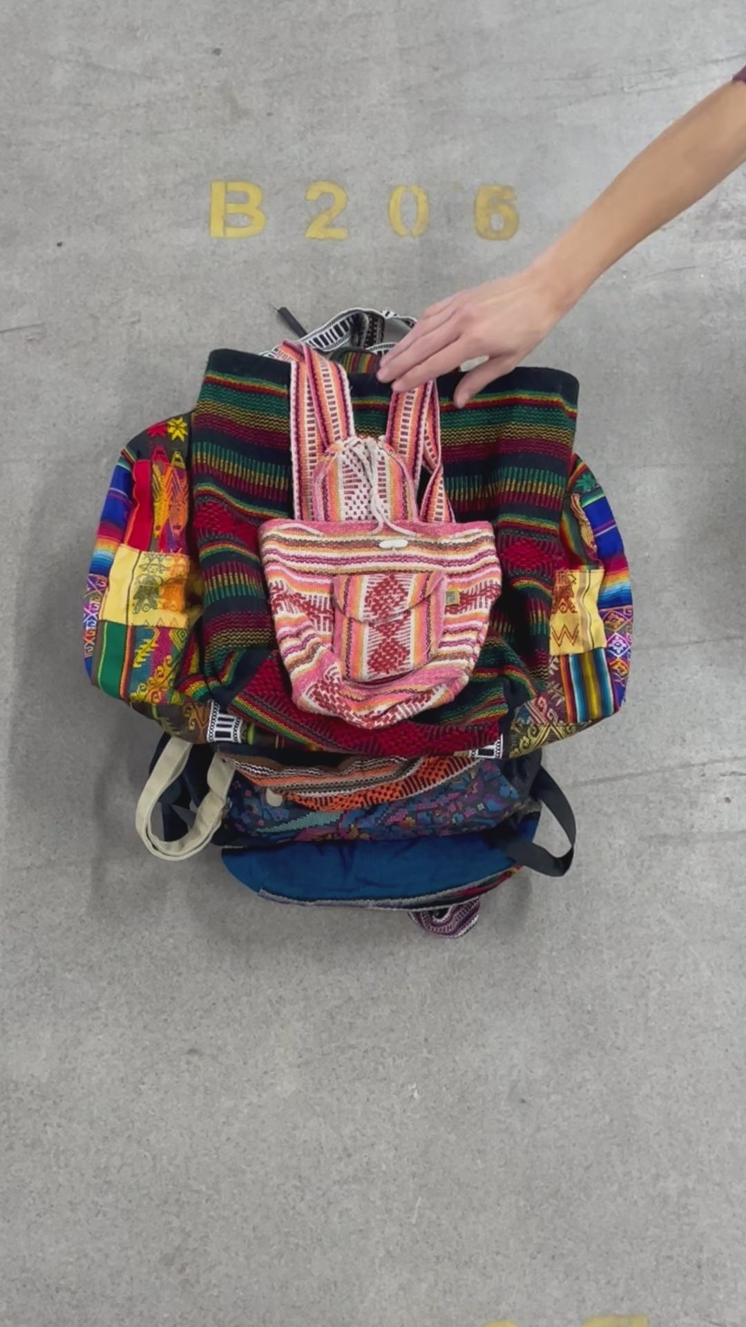 Collection of 25X  SOUTH AMERICAN SYLE BACKPACKS in a gallery layout
