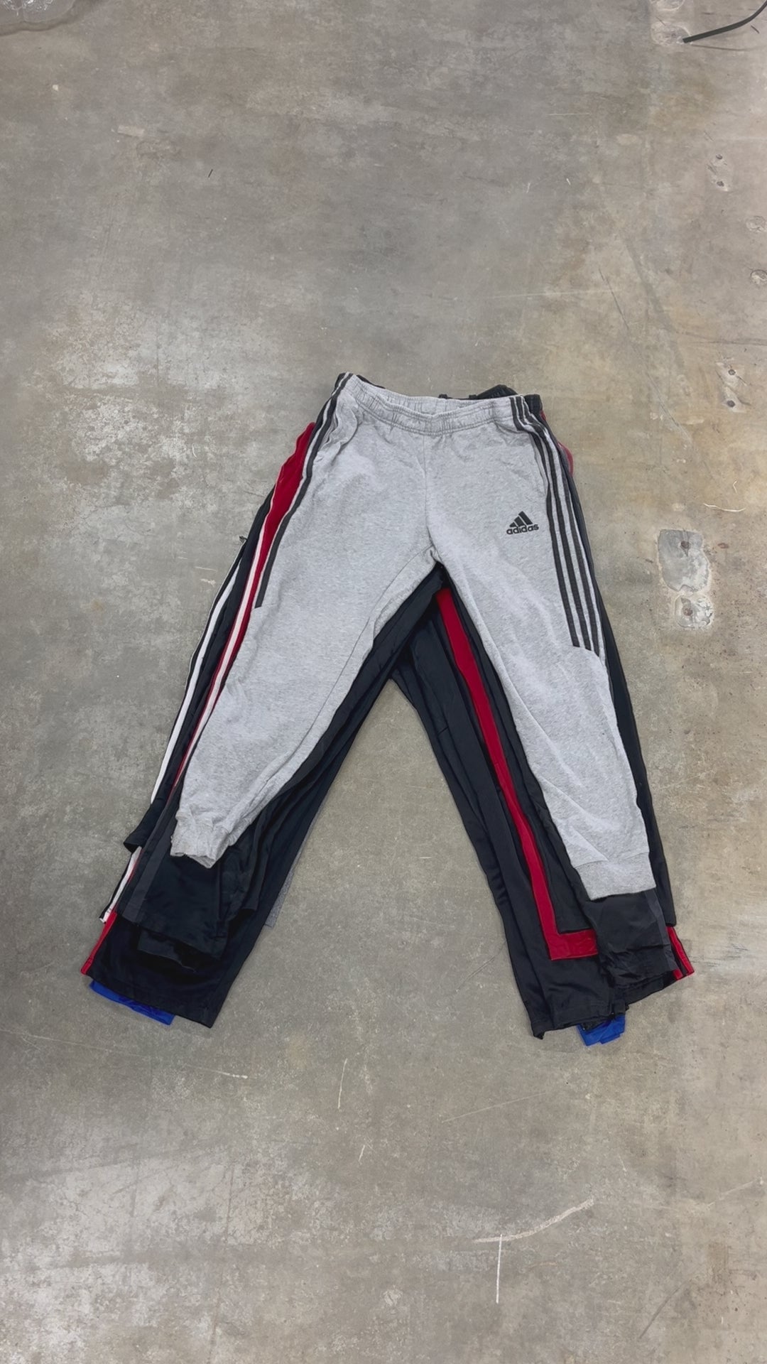 Collection of 50X ADIDAS TRACK PANTS in a gallery layout